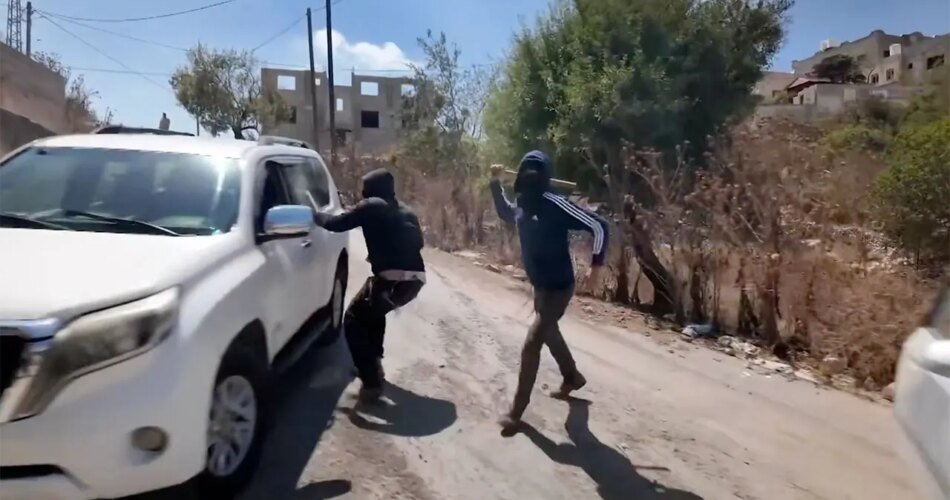Masked Israeli settlers attack NBC News crew and Palestinian family in West Bank
